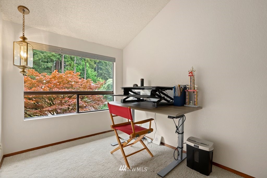 20830 28th Avenue Southeast Bothell, WA 98021 - Photo 25 of 40 a living room with furniture and a window