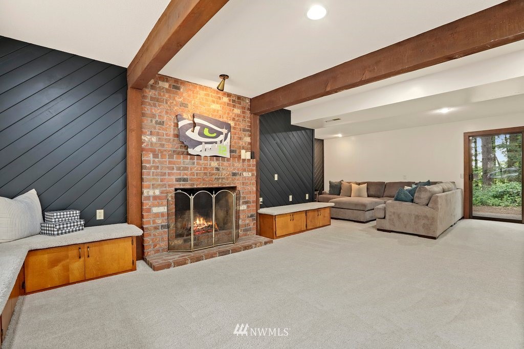 20830 28th Avenue Southeast Bothell, WA 98021 - Photo 26 of 40 a living room with furniture and a fireplace
