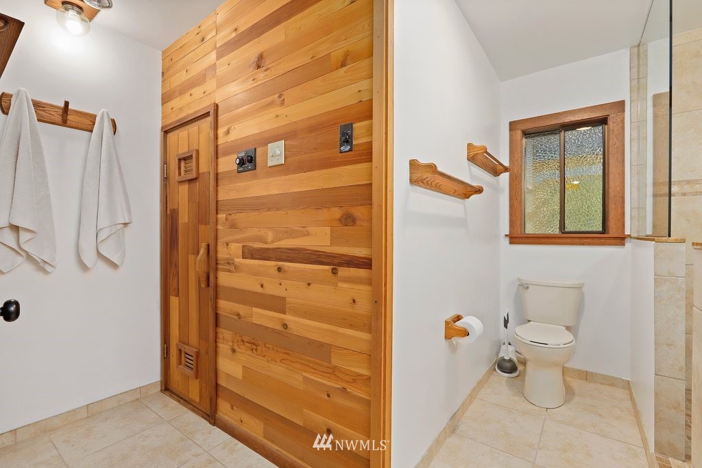 20830 28th Avenue Southeast Bothell, WA 98021 - Photo 29 of 40 a bathroom with a toilet sink and shower