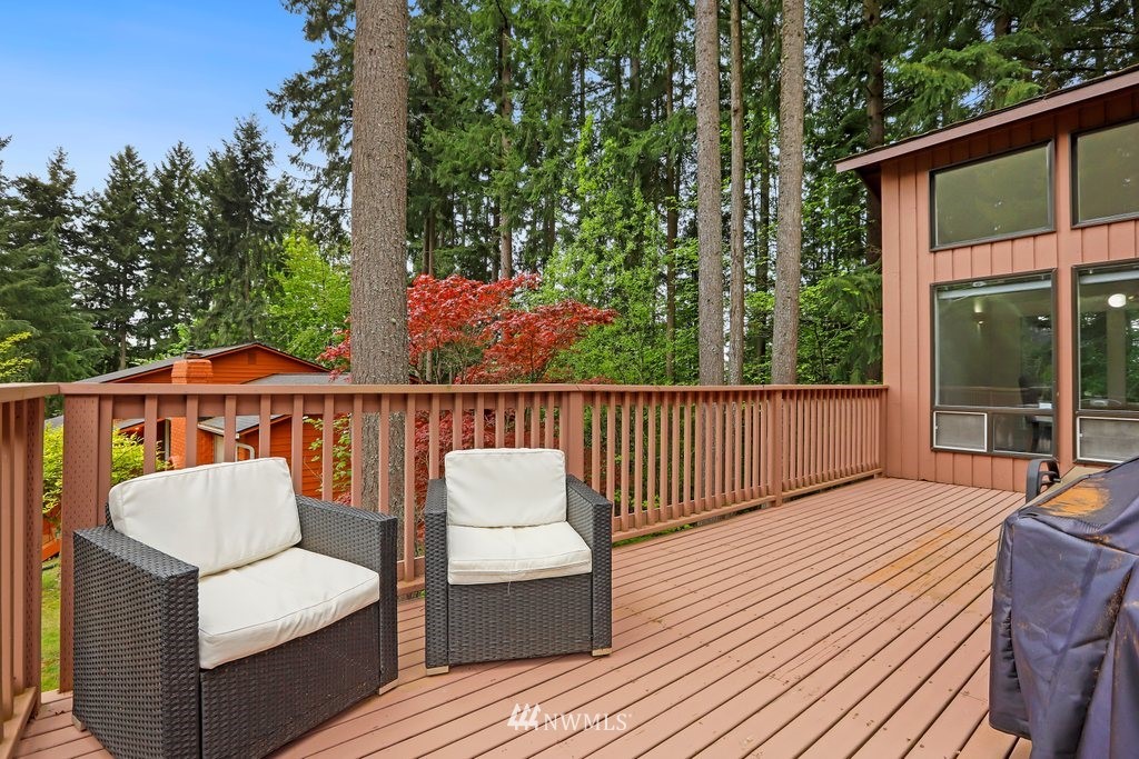 20830 28th Avenue Southeast Bothell, WA 98021 - Photo 7 of 40 a balcony with wooden floor and outdoor seating