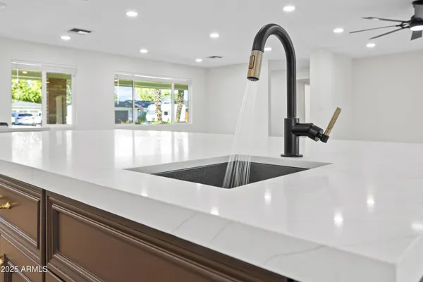 a stove top oven sitting inside of a kitchen