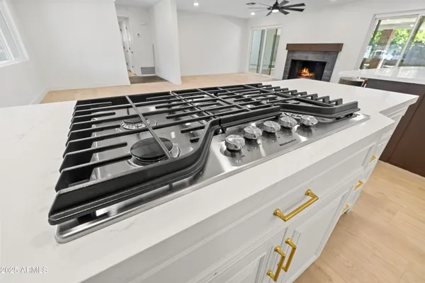 a view of an empty room with fire place and a fireplace