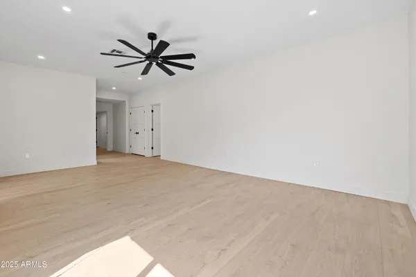 a bathroom with a double vanity sink a large mirror and shower