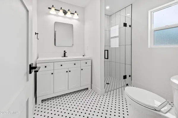a view of room with ceiling fan and wooden floor