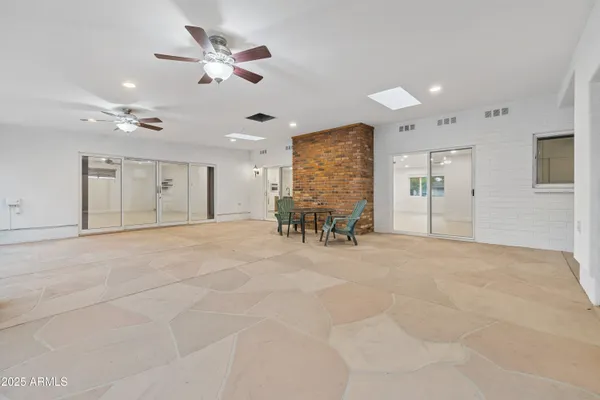 a large white kitchen with a window