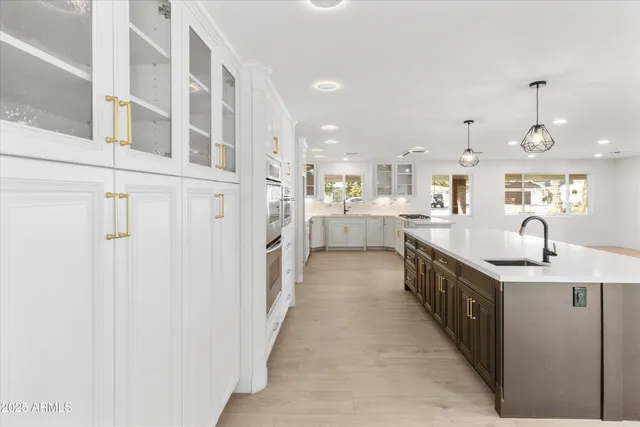 a large kitchen with a lot of counter space and a sink