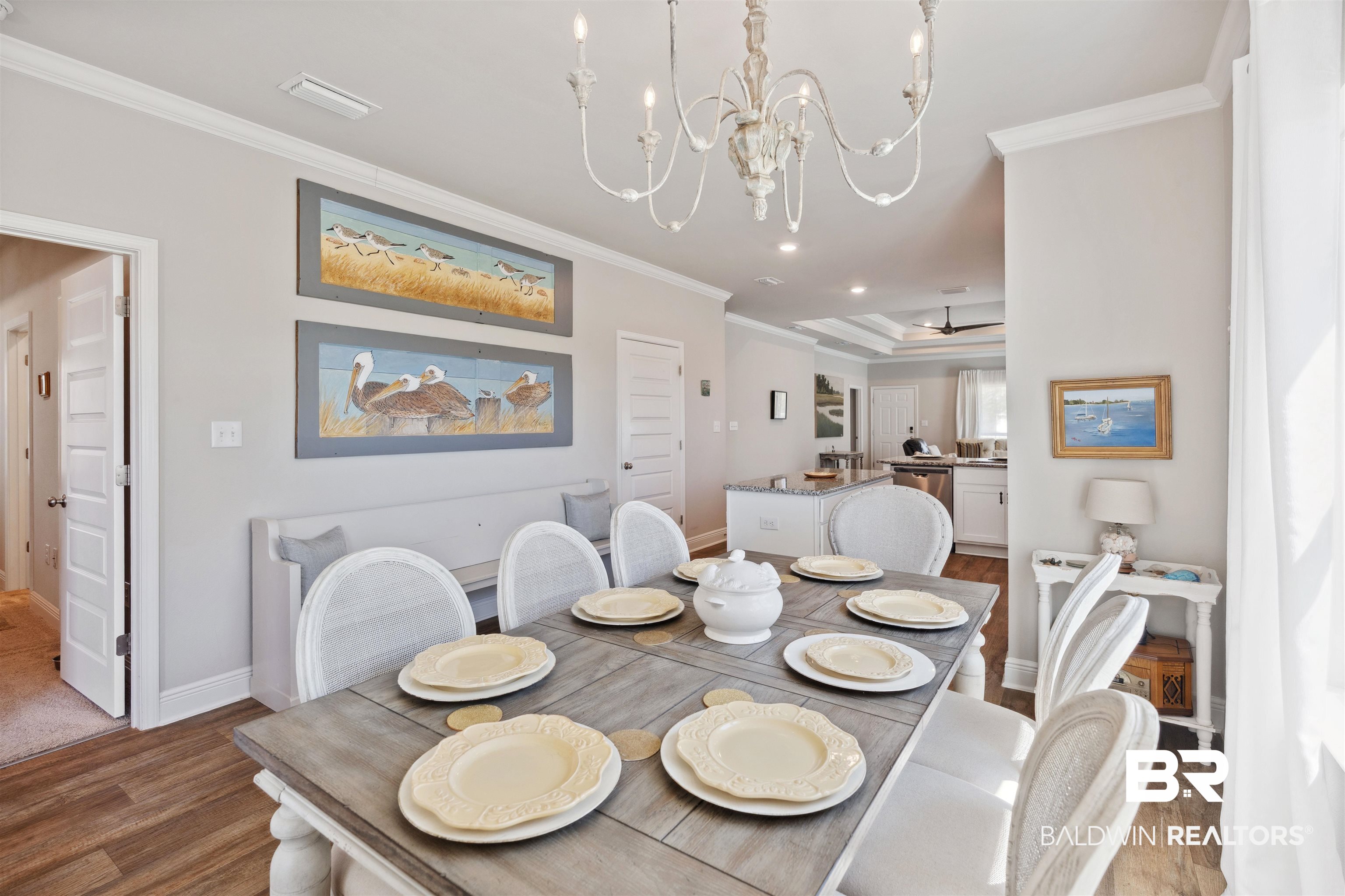 23809 Devonfield Lane Daphne, AL 36526 - Photo 15 of 29 Dining room featuring crown molding, baseboards, a chandelier, and wood finished floors