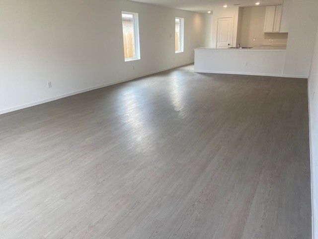3045 Colusa Rdg Drive Katy, TX 77493 - Photo 10 of 26 an empty room with wooden floor and windows