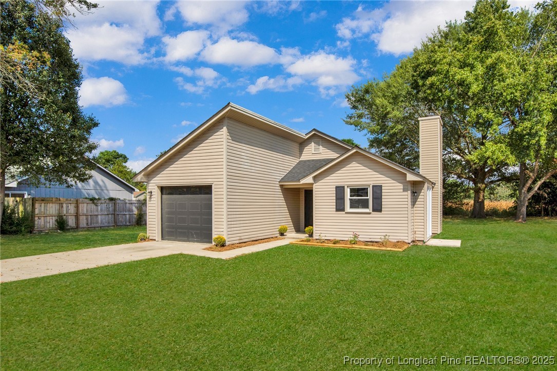 175 Eulon Loop Raeford, NC 28376 - Photo 3 of 23 a view of a house with a yard