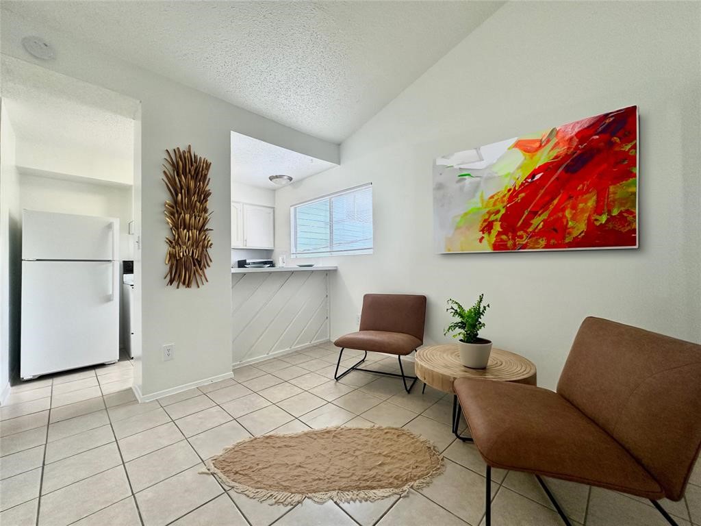 2410 Longview Street, Unit D102 Austin, TX 78705 - Photo 2 of 10 a workspace with furniture and wooden floor