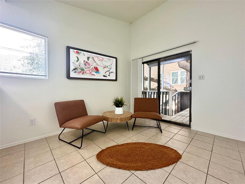 2410 Longview Street, Unit D102 Austin, TX 78705 - Photo 3 of 10 a living room with furniture and a rug