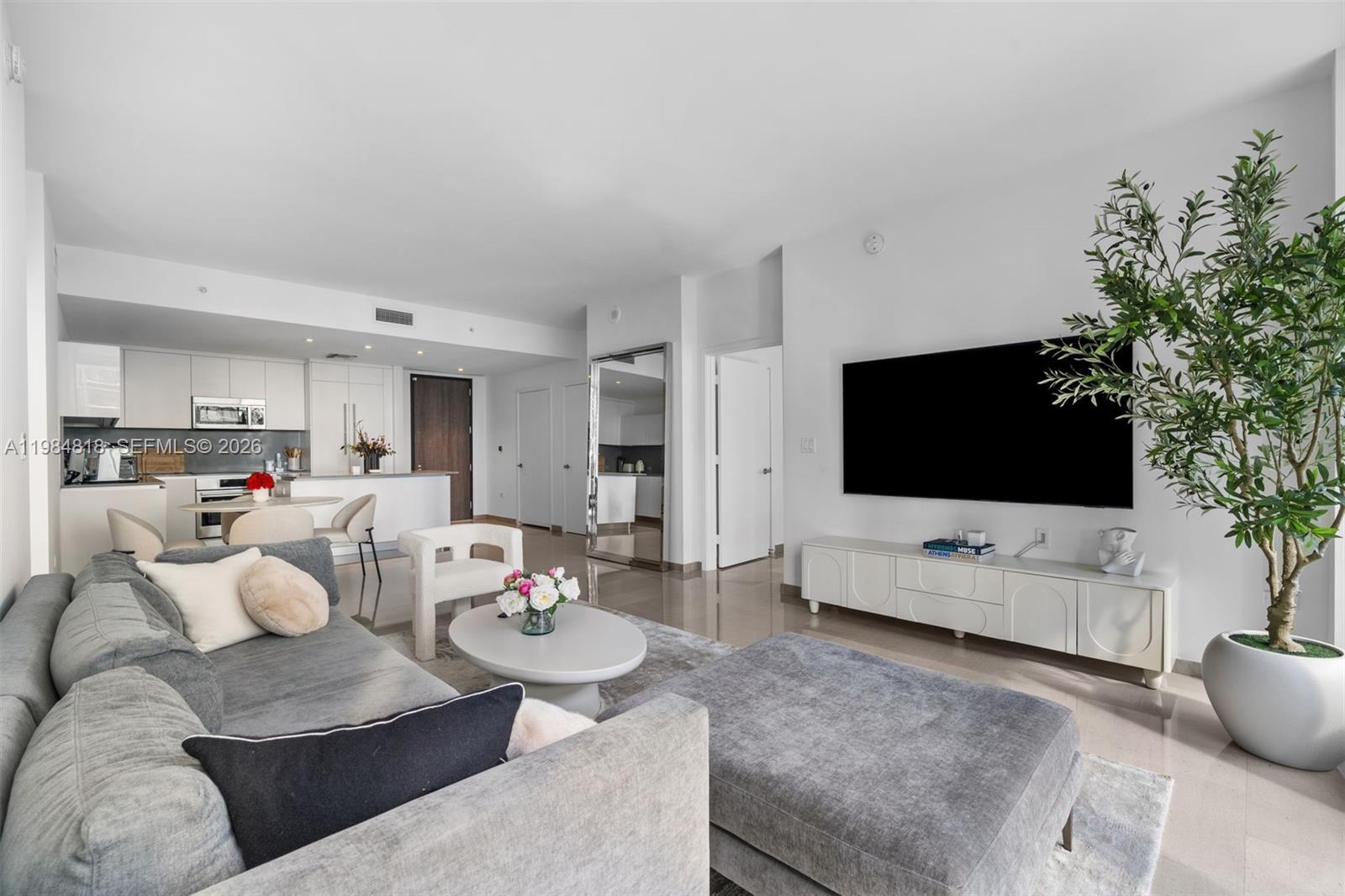 a living room with furniture and a flat screen tv