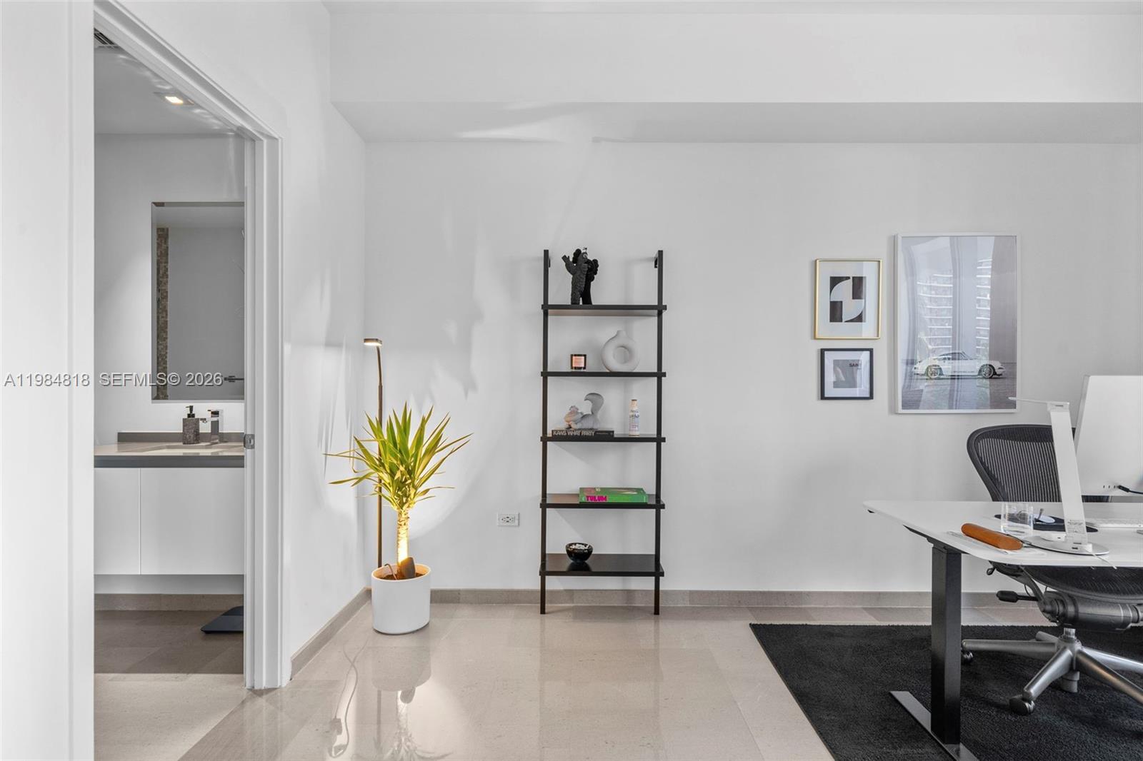 88 Southwest 7th Street, Unit 809 Miami, FL 33130 - Photo 21 of 39 a view of a workspace with furniture and wooden floor