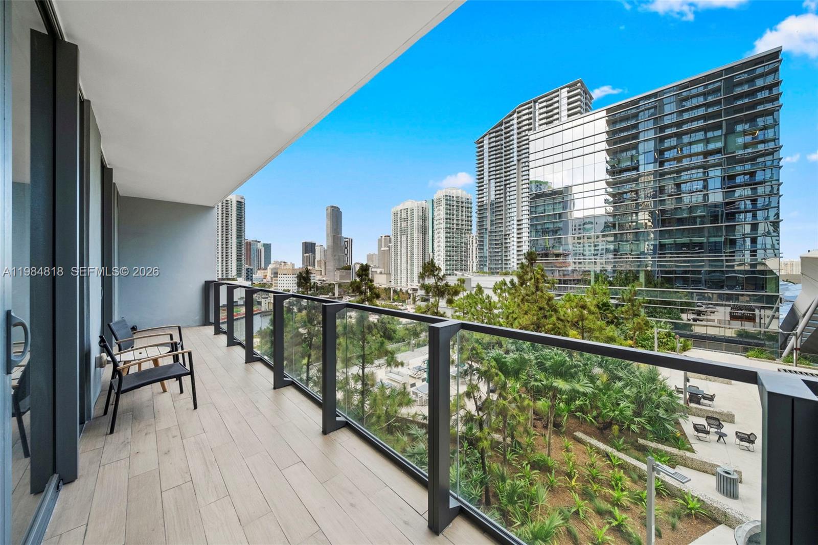 88 Southwest 7th Street, Unit 809 Miami, FL 33130 - Photo 25 of 39 a view of balcony with chairs