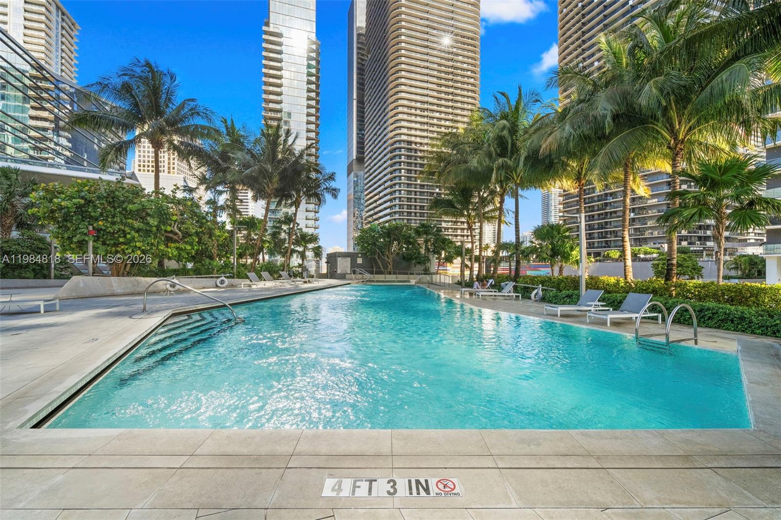 88 Southwest 7th Street, Unit 809 Miami, FL 33130 - Photo 29 of 39 a view of swimming pool with a patio