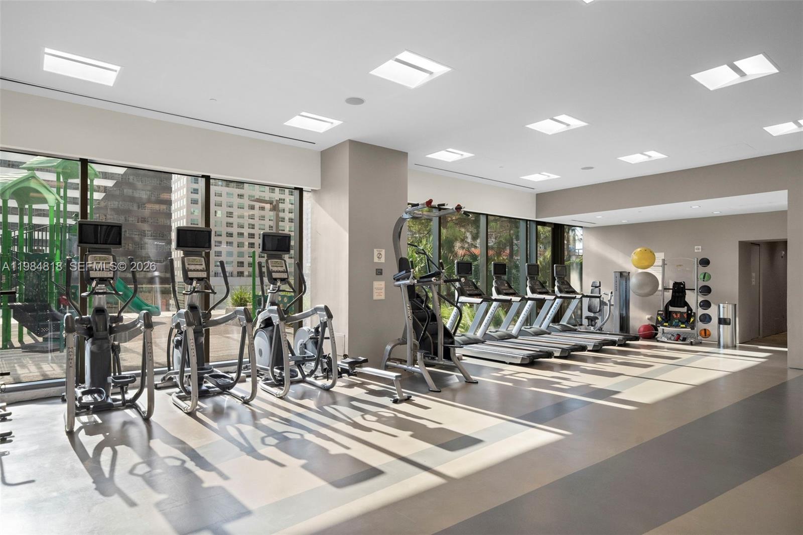 88 Southwest 7th Street, Unit 809 Miami, FL 33130 - Photo 35 of 39 a view of a room with gym equipment