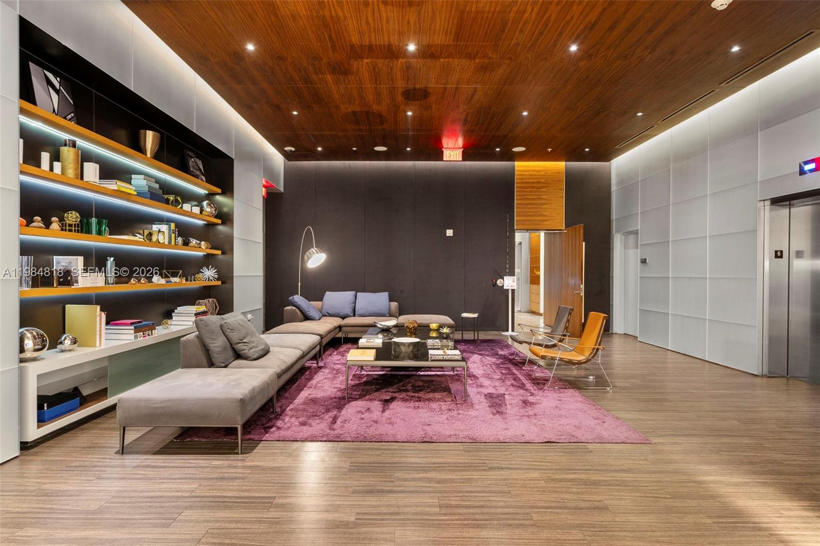 88 Southwest 7th Street, Unit 809 Miami, FL 33130 - Photo 38 of 39 a bedroom with furniture and a chandelier