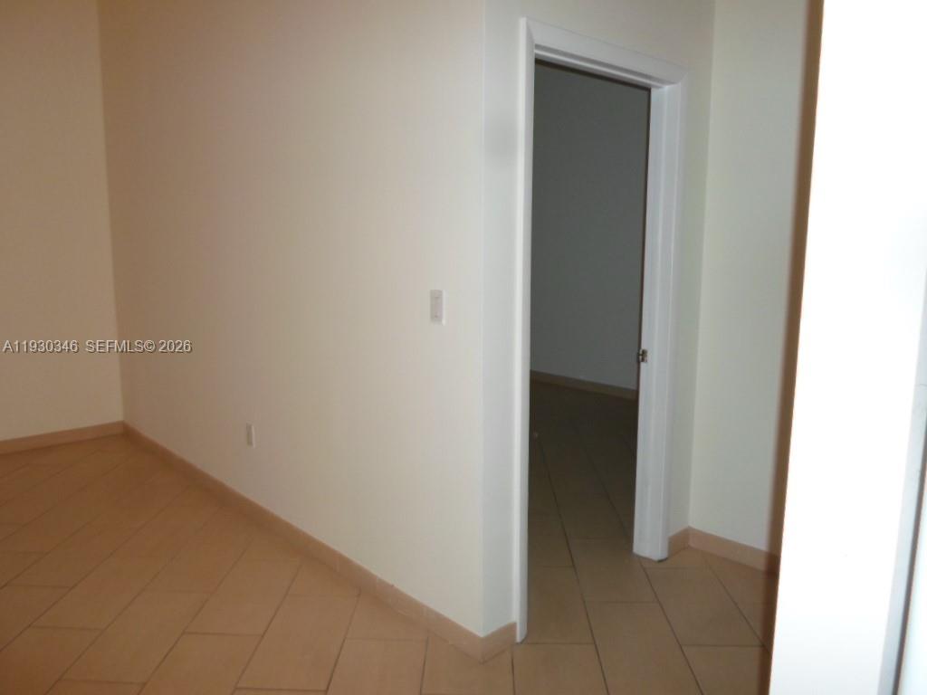 7275 Southwest 90th Way, Unit G 611 Miami, FL 33156 - Photo 47 of 56 a view of an empty room