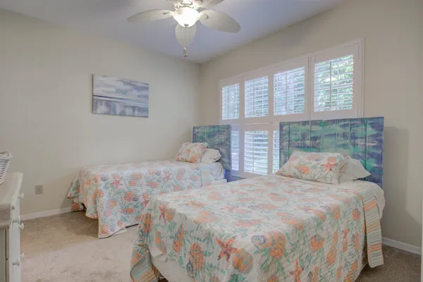 a spacious bedroom with a bed and a window