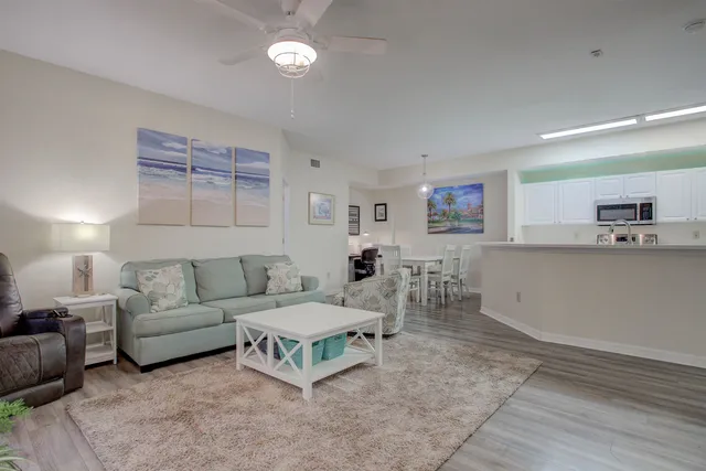 an aerial view of residential houses with outdoor space and pool