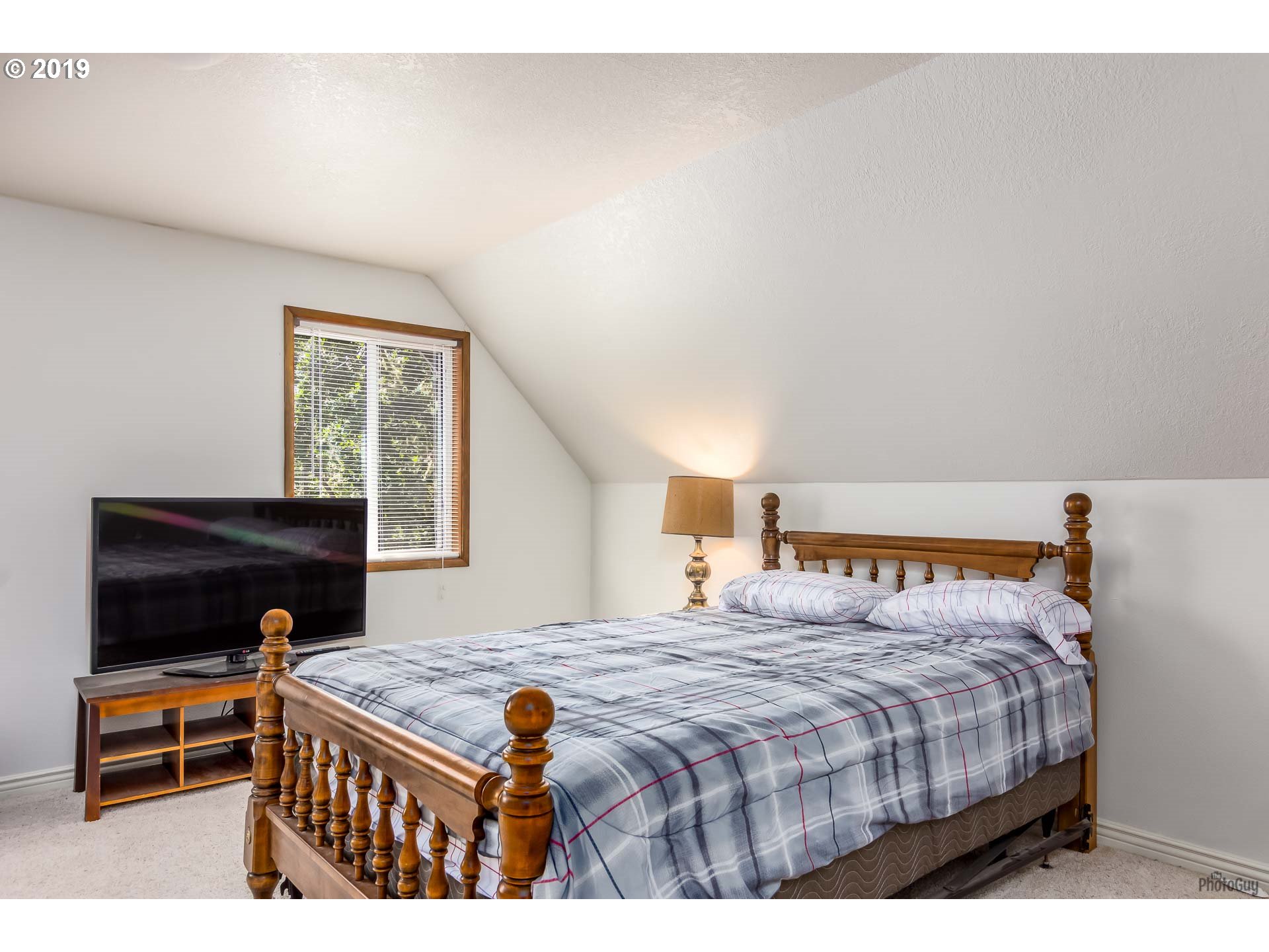 39639 Jasper Lowell Road Lowell, OR 97452 - Photo 12 of 32 a bedroom with a bed and a window
