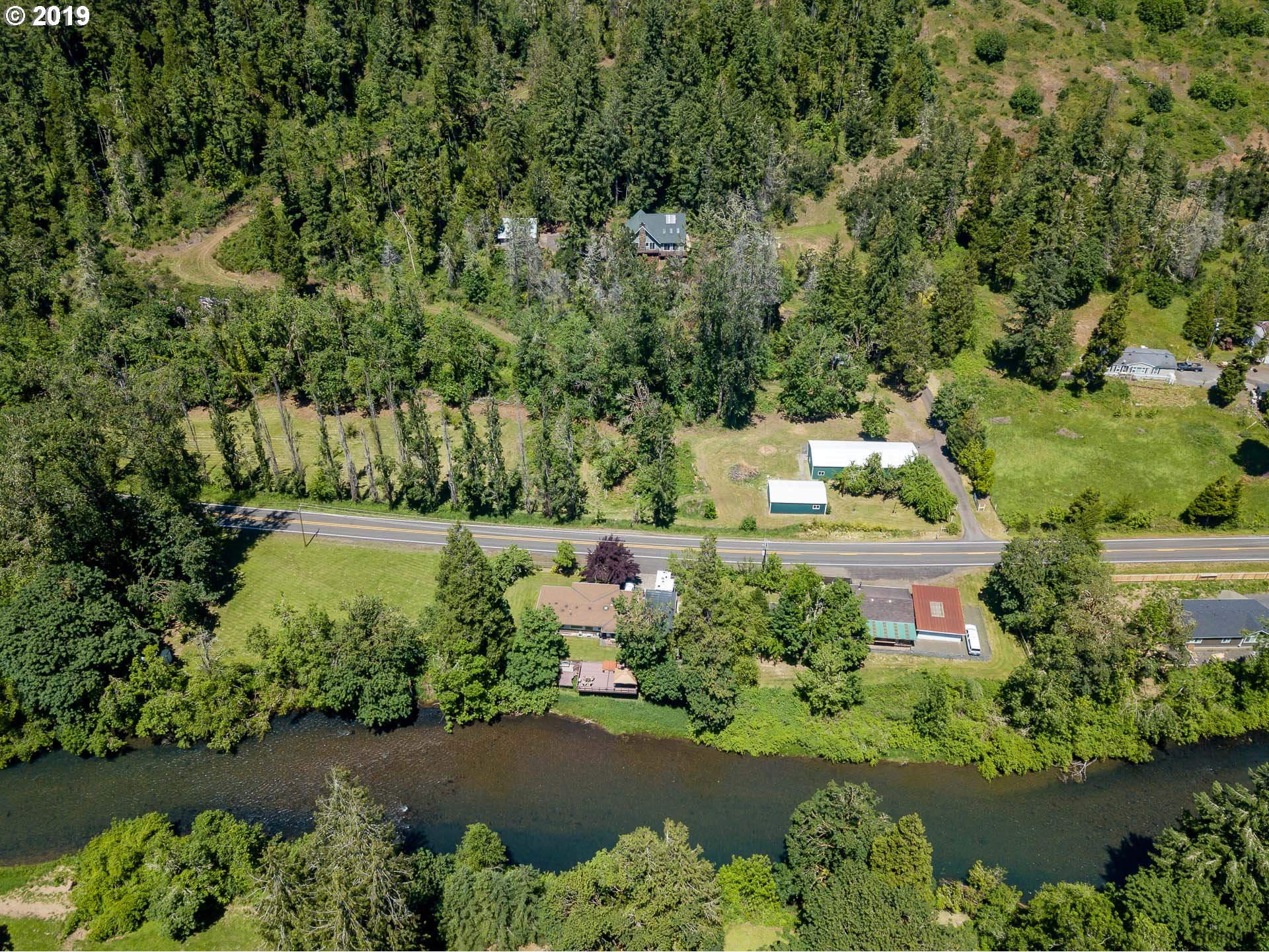 39639 Jasper Lowell Road Lowell, OR 97452 - Photo 25 of 32 an aerial view of a house with a yard and lake view