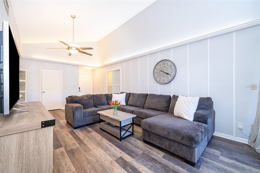 3916 Atrium Drive, Unit 4 Orlando, FL 32822 - Photo 12 of 71 a living room with furniture a ceiling fan and a rug