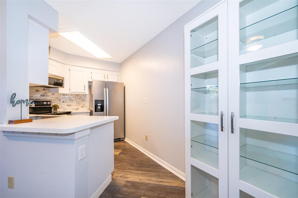 3916 Atrium Drive, Unit 4 Orlando, FL 32822 - Photo 14 of 71 a kitchen with stainless steel appliances a refrigerator and a stove