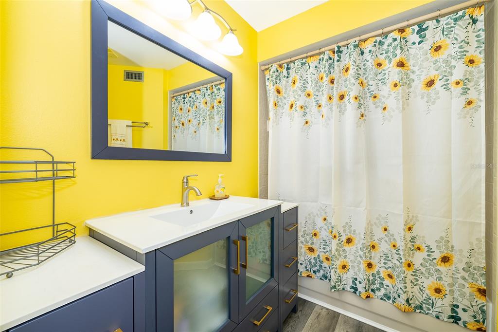 3916 Atrium Drive, Unit 4 Orlando, FL 32822 - Photo 25 of 71 a bathroom with a sink and a mirror