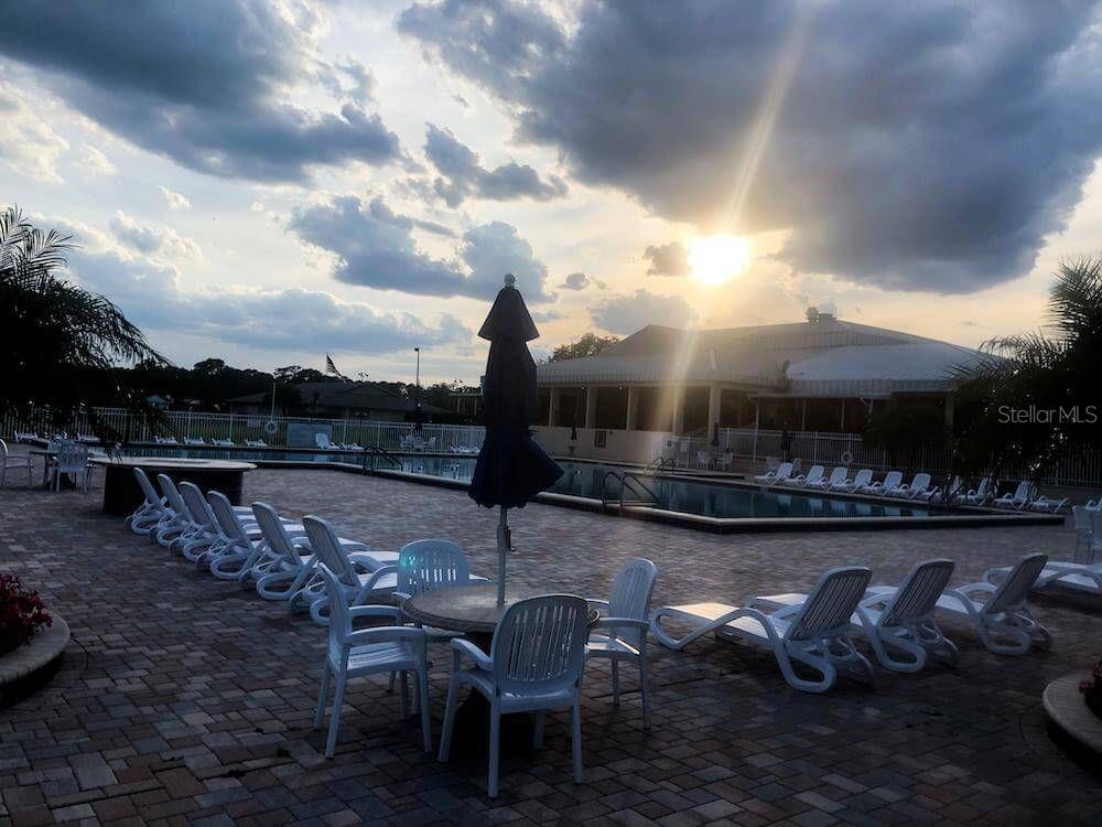 3916 Atrium Drive, Unit 4 Orlando, FL 32822 - Photo 38 of 71 a terrace with outdoor seating and city view