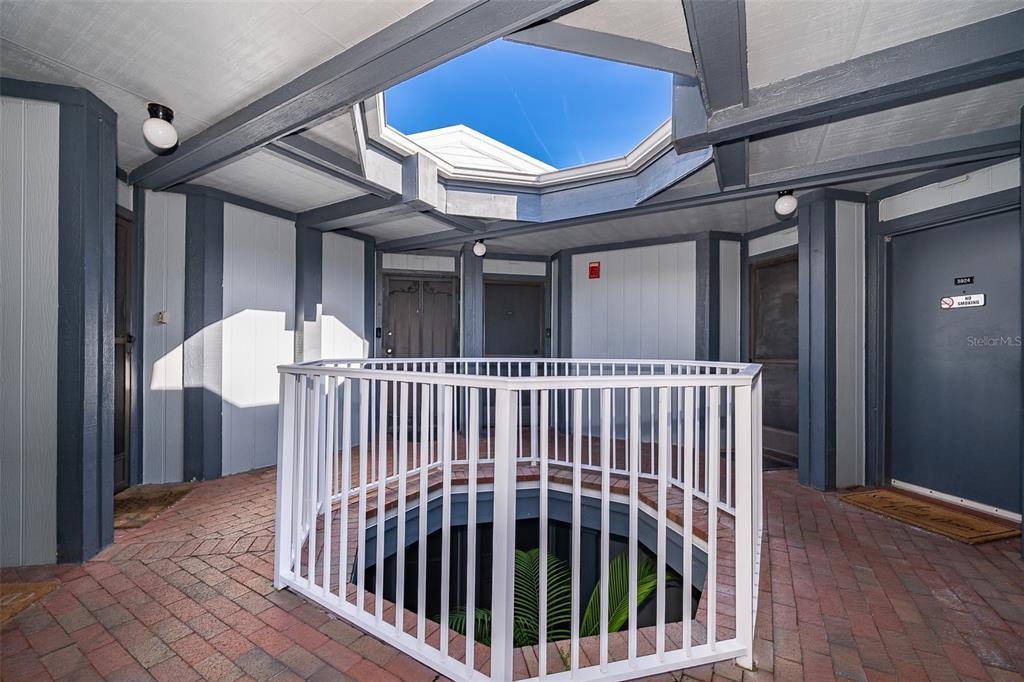 3916 Atrium Drive, Unit 4 Orlando, FL 32822 - Photo 4 of 71 a view of a balcony with staircase