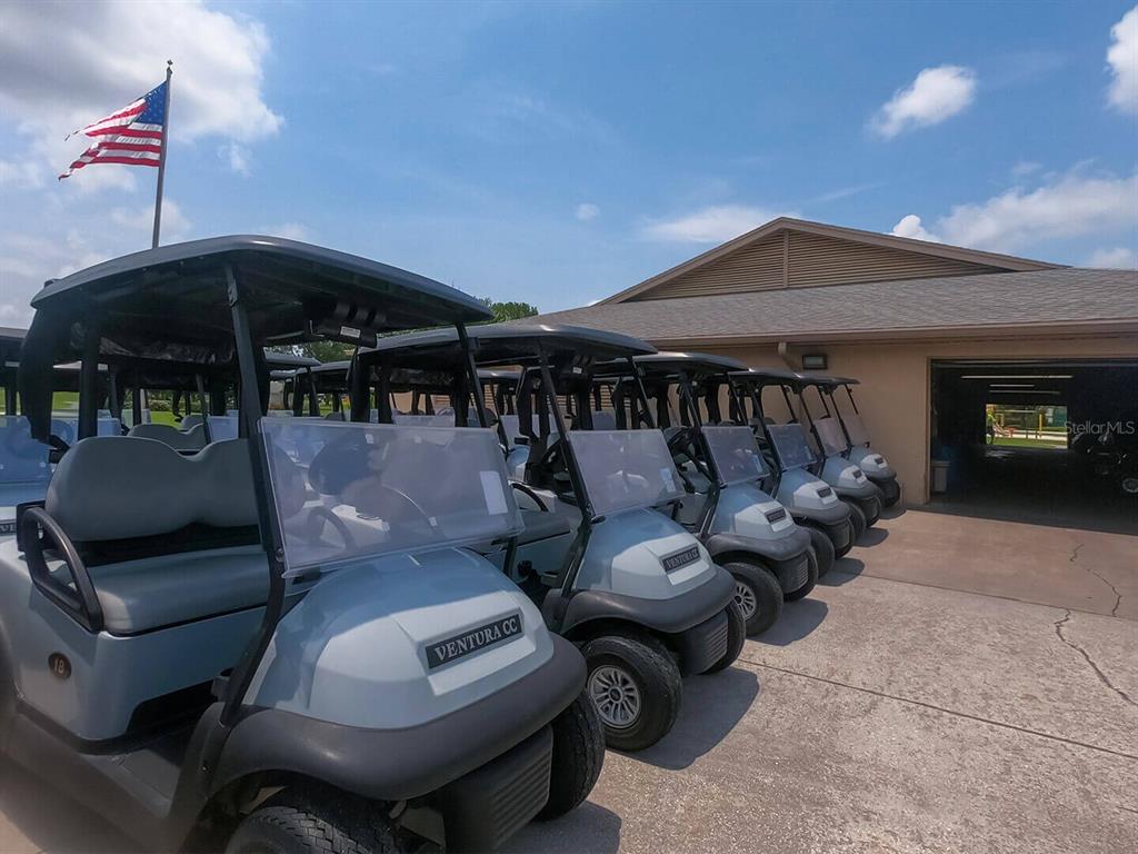 3916 Atrium Drive, Unit 4 Orlando, FL 32822 - Photo 46 of 71 a roof deck with table and chairs under an umbrella