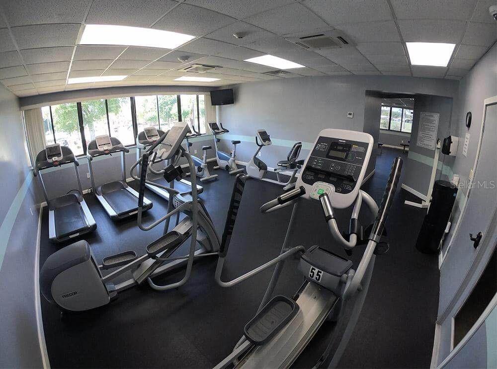 3916 Atrium Drive, Unit 4 Orlando, FL 32822 - Photo 50 of 71 a room with gym equipment
