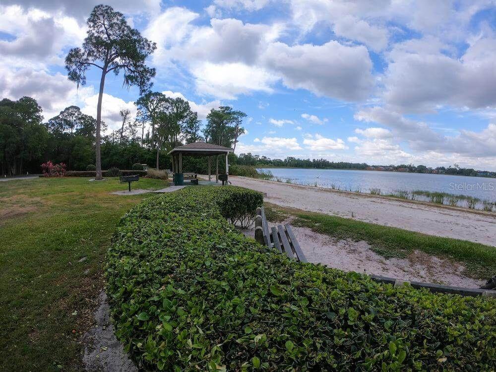 3916 Atrium Drive, Unit 4 Orlando, FL 32822 - Photo 55 of 71 a view of a pathway with a big yard