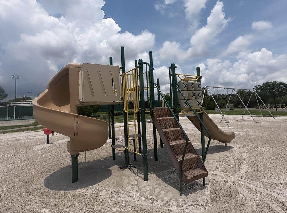 3916 Atrium Drive, Unit 4 Orlando, FL 32822 - Photo 60 of 71 a roof deck with table and chairs