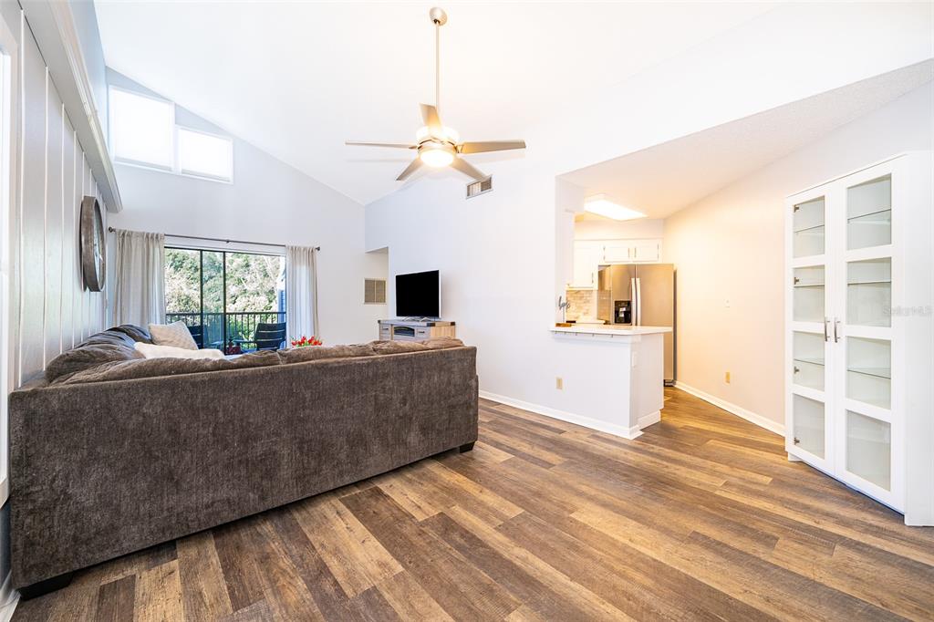 3916 Atrium Drive, Unit 4 Orlando, FL 32822 - Photo 9 of 71 a living room with furniture and flat screen tv