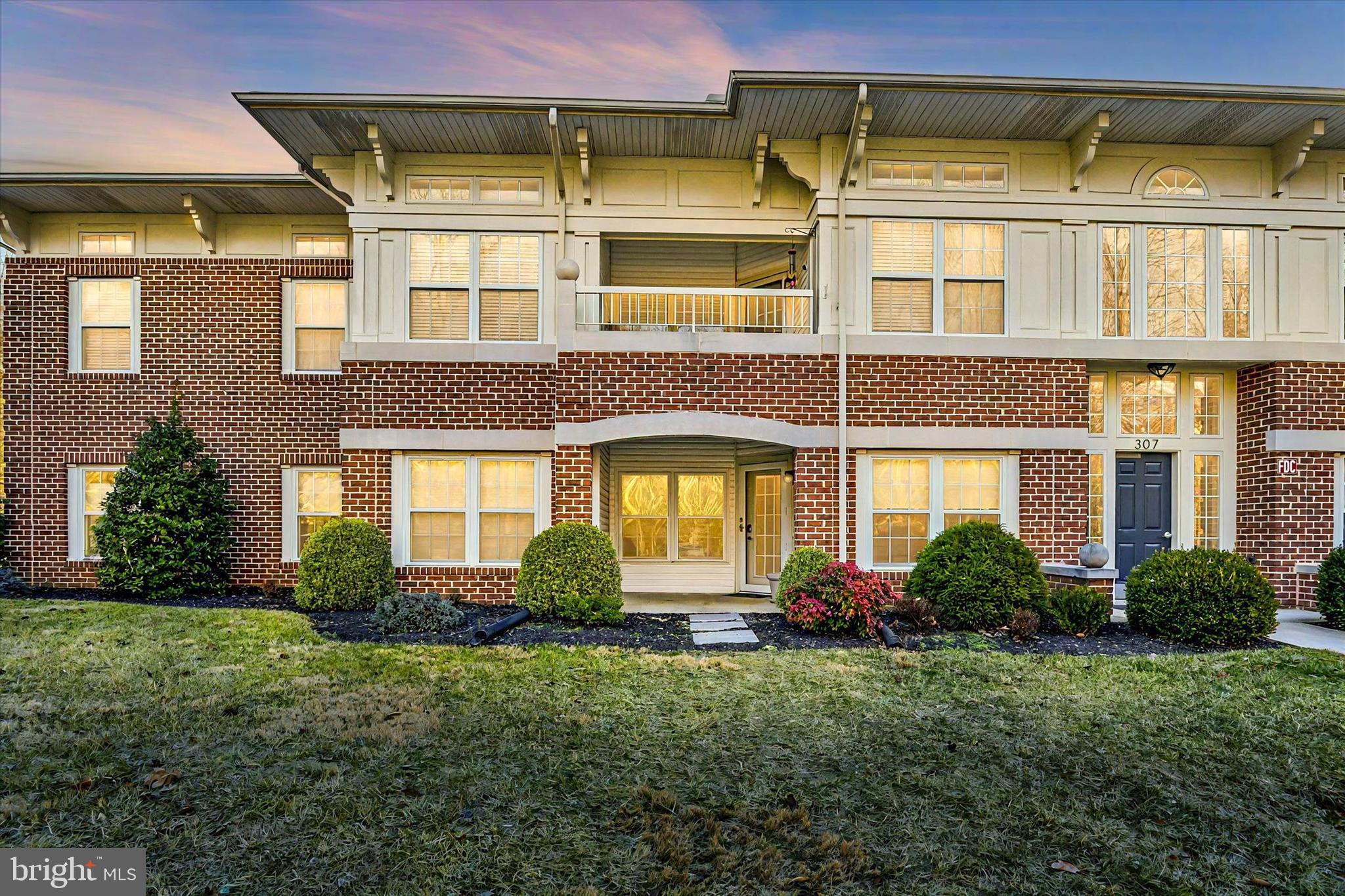 307 Laurel Woods Drive, Unit A Abingdon, MD 21009 - Photo 1 of 24 a front view of a house with garden
