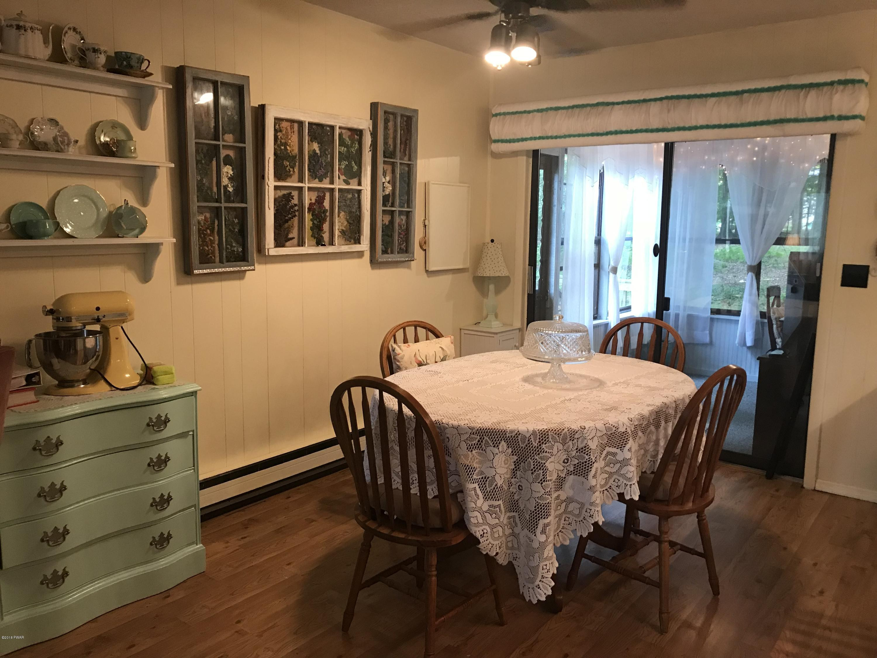 3187 Northgate Road Lake Ariel, PA 18436 - Photo 3 of 29 a dining room with furniture and wooden floor
