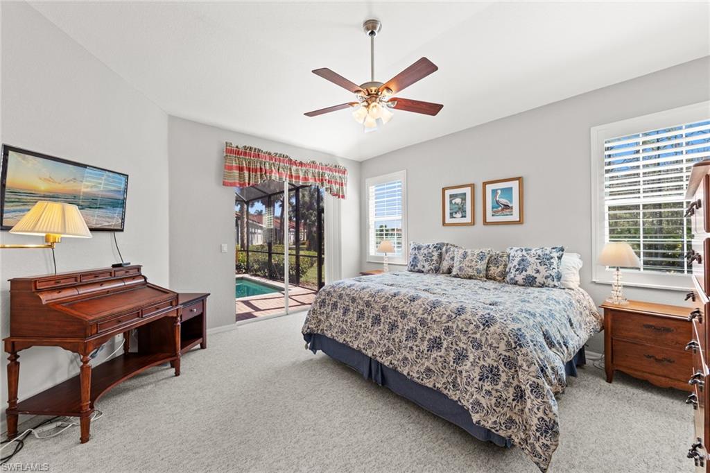 10205 Cape Roman Road Bonita Springs, FL 34135 - Photo 11 of 31 a bedroom with a bed and a window