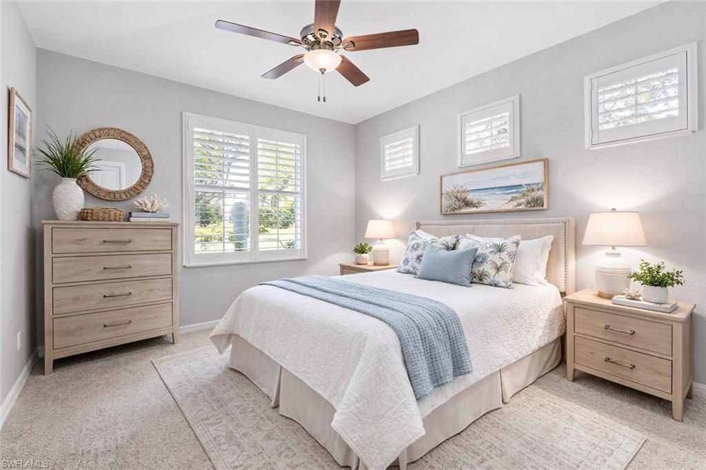 10205 Cape Roman Road Bonita Springs, FL 34135 - Photo 14 of 31 a bedroom with a bed and a window