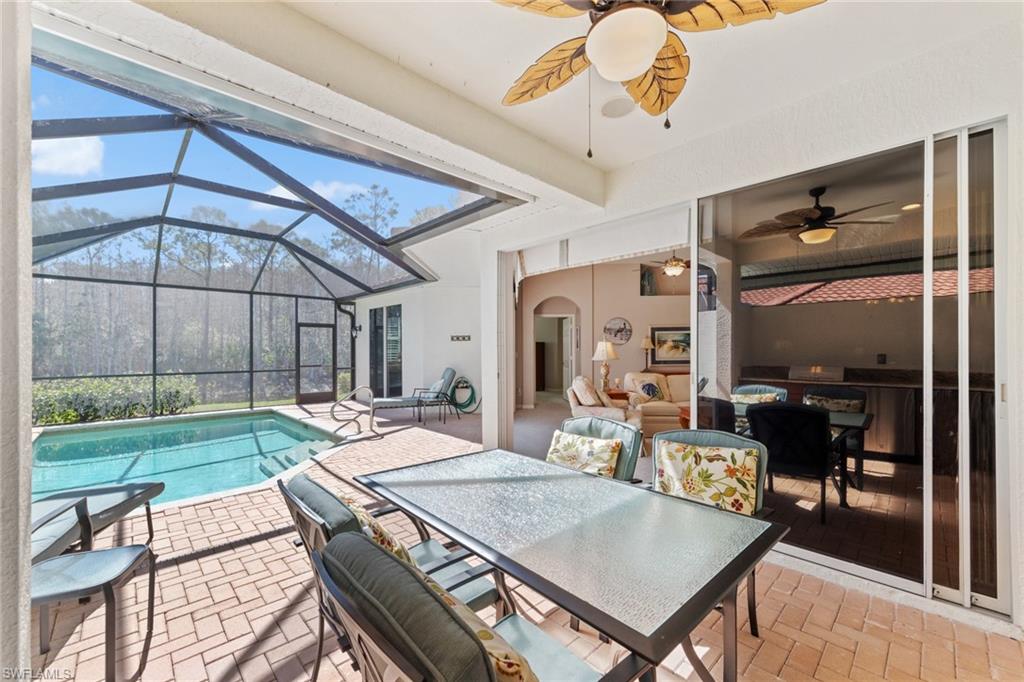 10205 Cape Roman Road Bonita Springs, FL 34135 - Photo 21 of 31 a view of a livingroom with furniture and a table