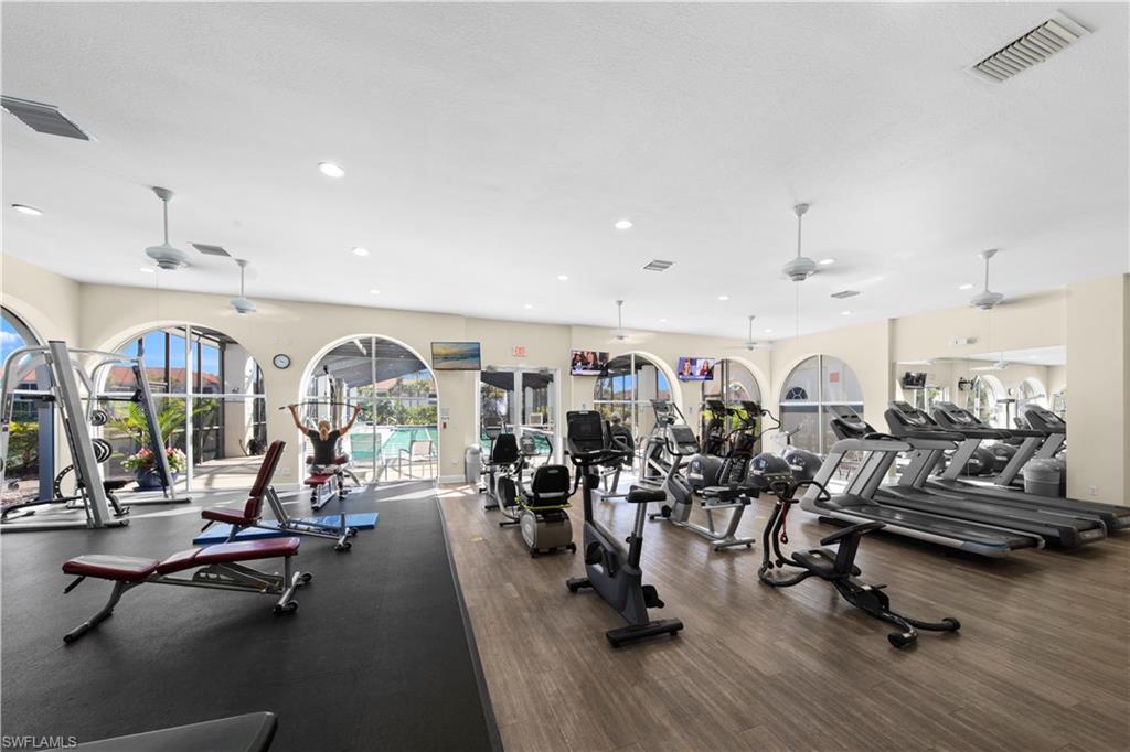 10205 Cape Roman Road Bonita Springs, FL 34135 - Photo 24 of 31 a view of a room with gym equipment