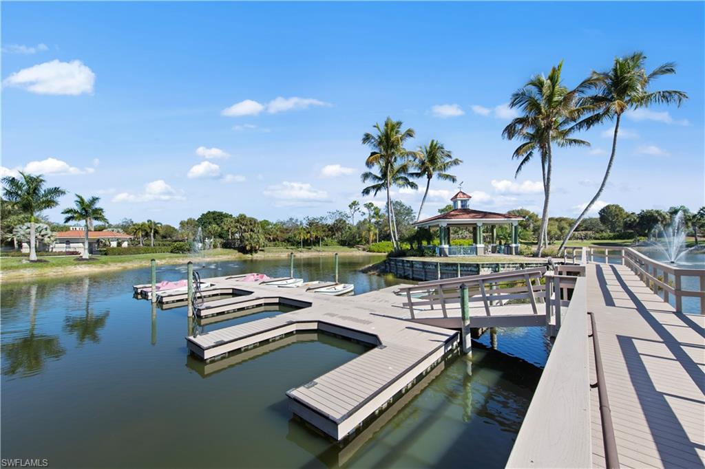 10205 Cape Roman Road Bonita Springs, FL 34135 - Photo 27 of 31 a view of a lake with couches chairs