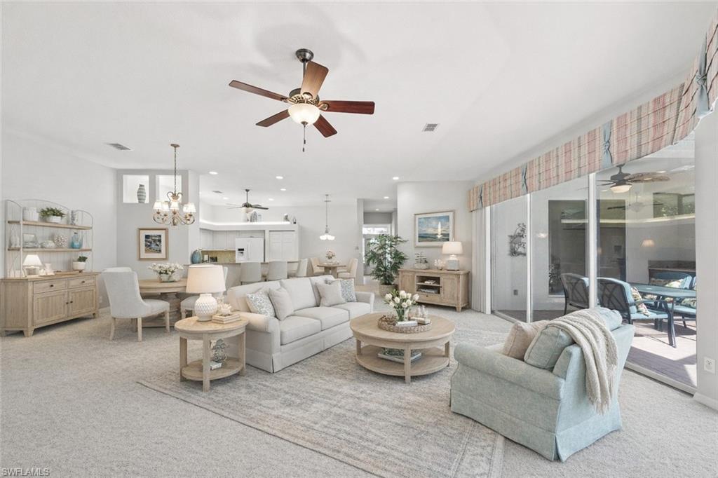 10205 Cape Roman Road Bonita Springs, FL 34135 - Photo 4 of 31 a living room with furniture and a large window