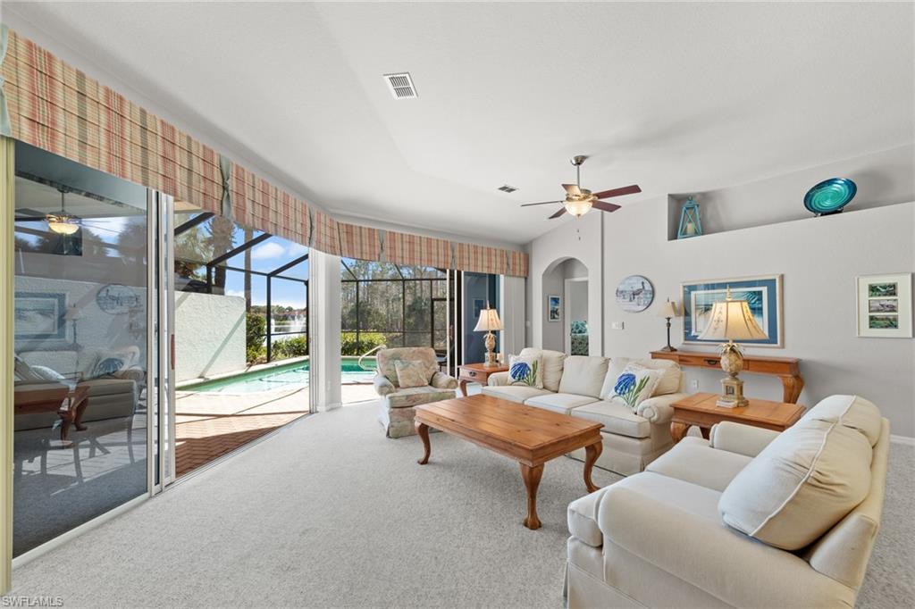 10205 Cape Roman Road Bonita Springs, FL 34135 - Photo 6 of 31 a living room with furniture and a large window