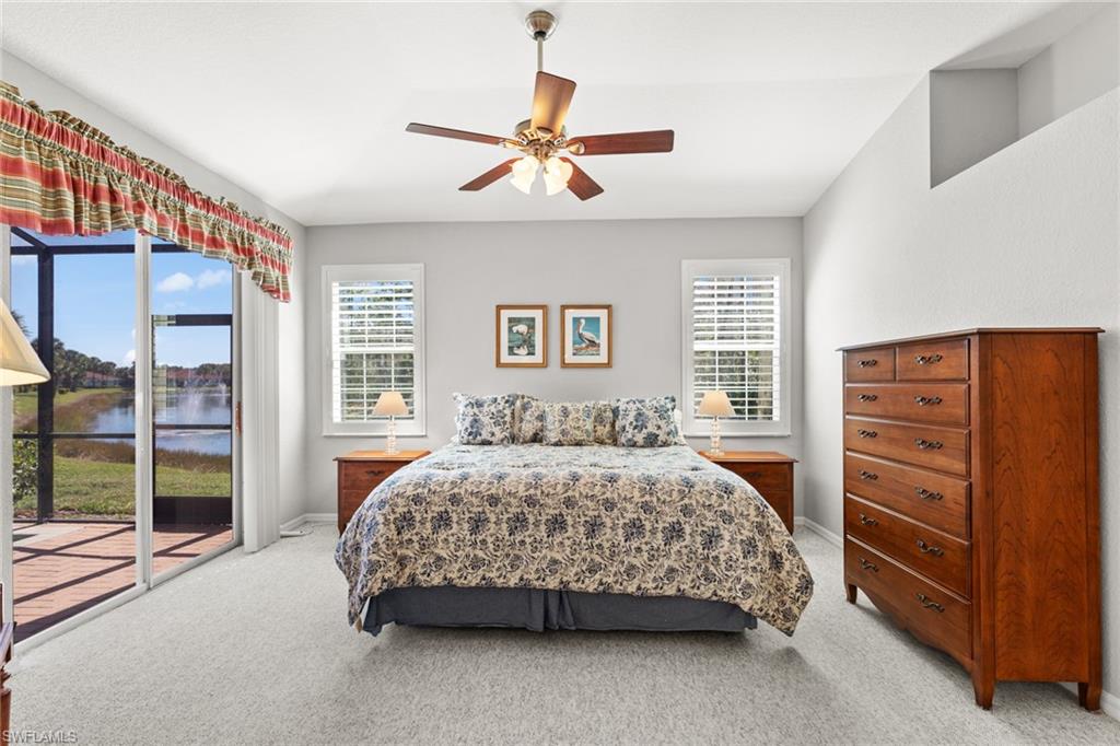 10205 Cape Roman Road Bonita Springs, FL 34135 - Photo 9 of 31 a bedroom with a bed and a dresser