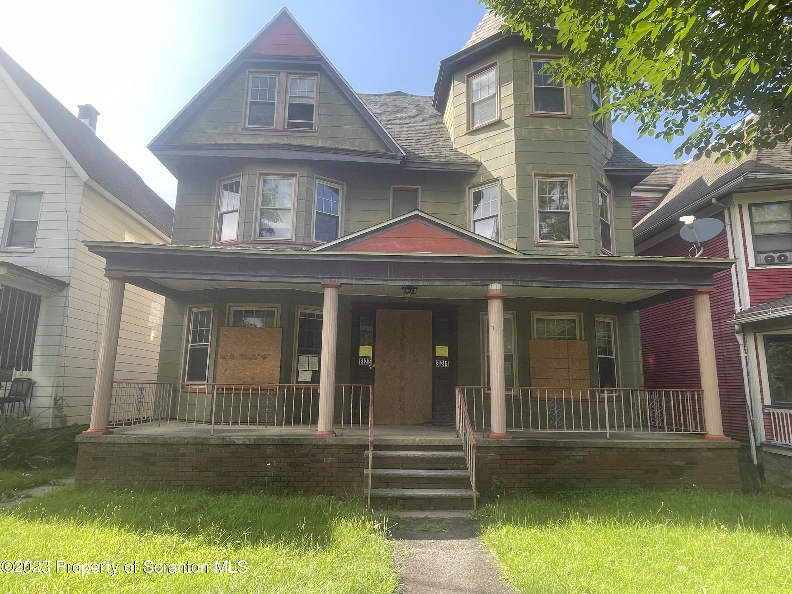 front view of a house with a yard