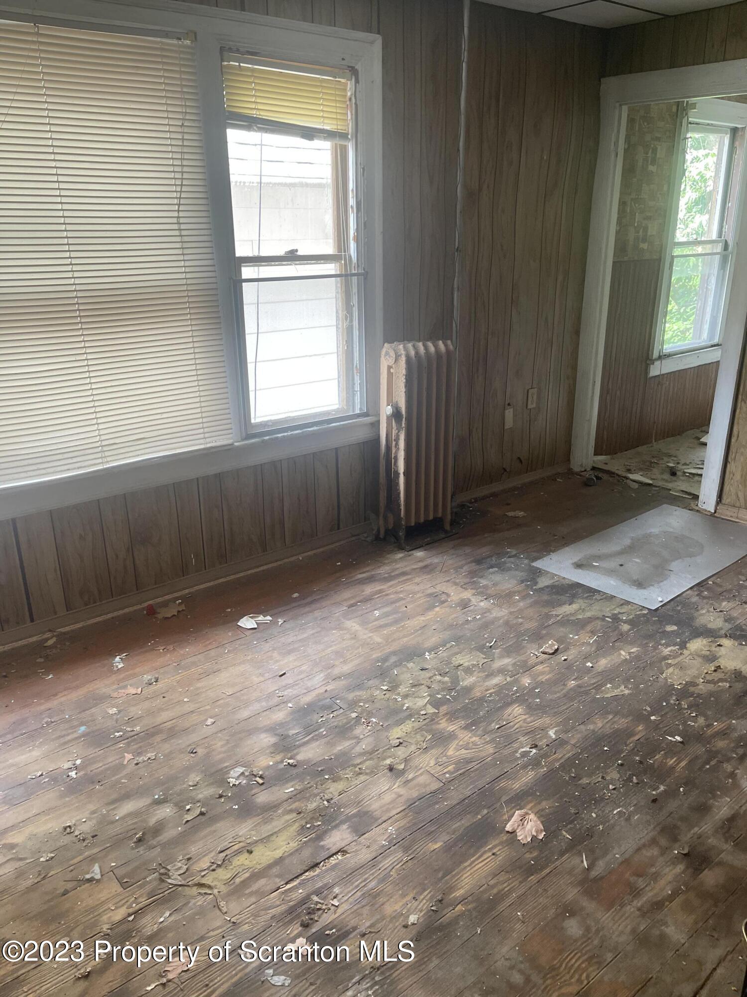 831 Monroe Avenue Scranton, PA 18510 - Photo 11 of 35 an empty room with windows