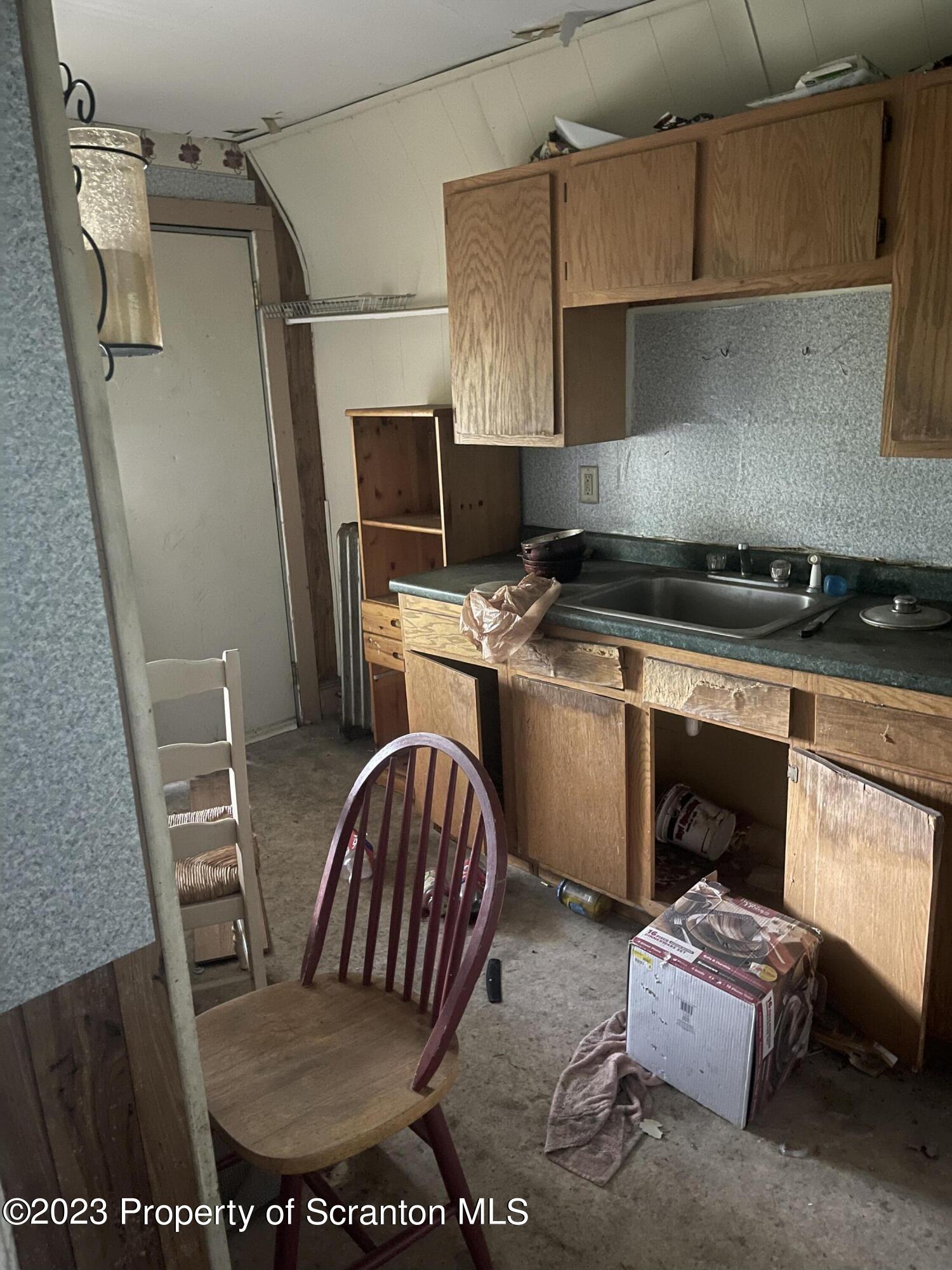 831 Monroe Avenue Scranton, PA 18510 - Photo 13 of 35 a kitchen with stainless steel appliances granite countertop a stove a sink and a refrigerator