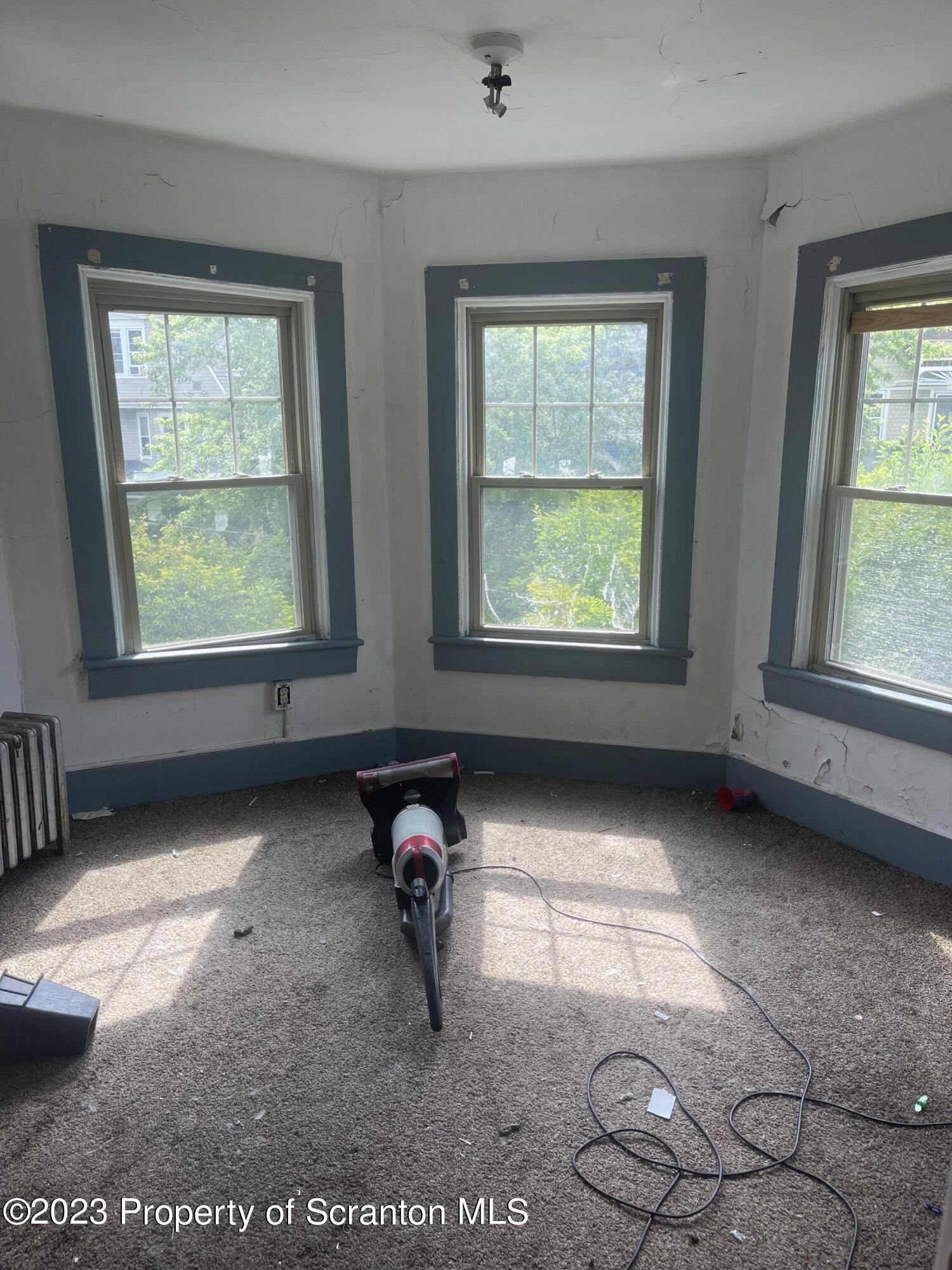 831 Monroe Avenue Scranton, PA 18510 - Photo 17 of 35 a view of an empty room with a window